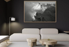 Modern living room with a large framed black and white mountain landscape photo of the Dents du Midi on the wall.