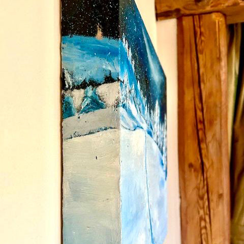 Side view of winter scene painting called. Enchanted in blues and greys.