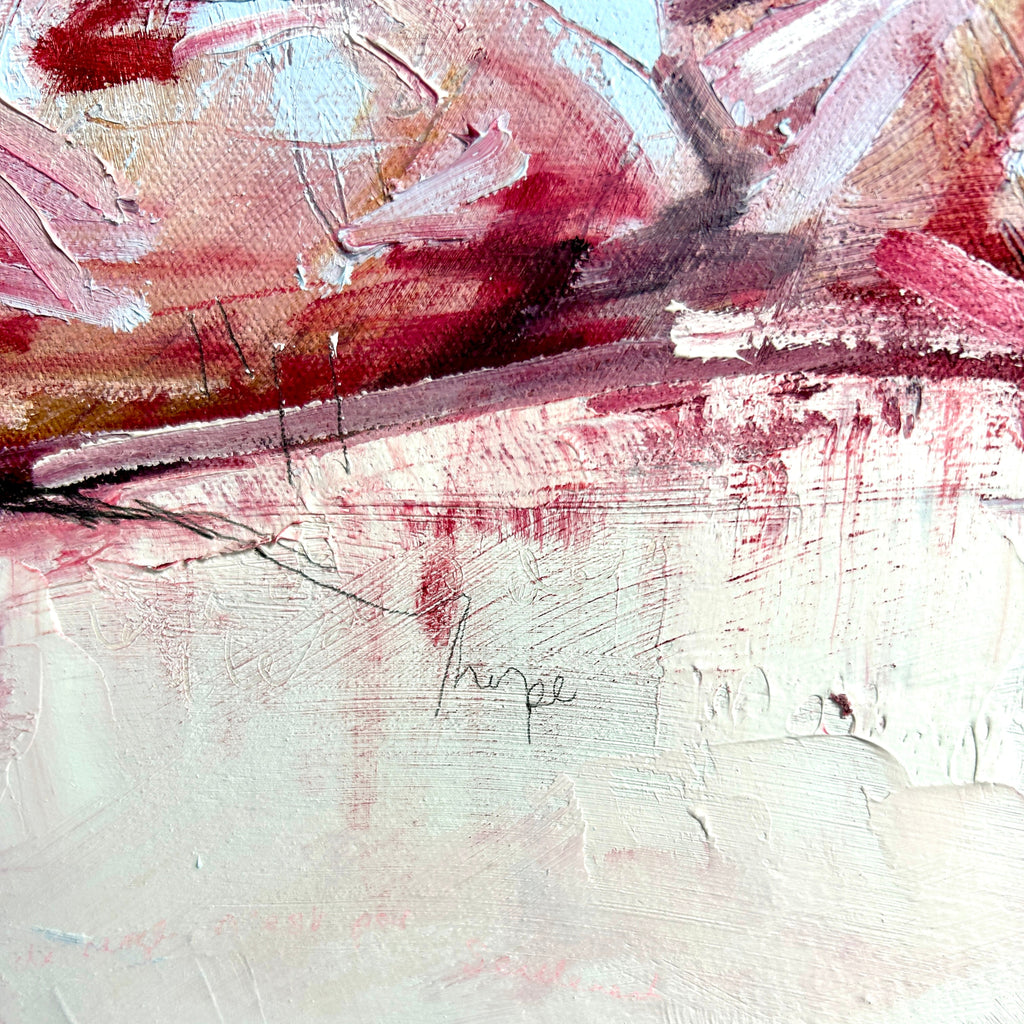 Abstract brushstrokes with red and white oil paint on a textured surface. snowscape painting close-up.