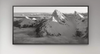 Framed black and white mountain landscape on a wall