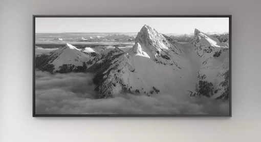 Framed black and white mountain landscape on a wall
