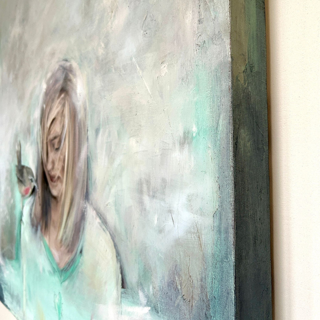 side view of portrait painting in oils of a person with a bird