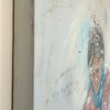 Side view of a painting of a man in a snowy winter scene. Oil painting with textured details