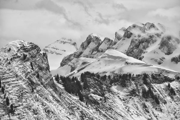 Dents du Midi photographic print showing snow-covered alpine peaks with clouds and forested slopes