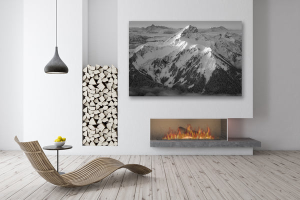 black and white photo of Mont de grange framed above a fireplace in a chalet 