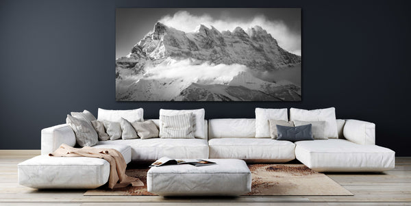 large format mountain photo of the Dents Du Midi in a living room above a sofa