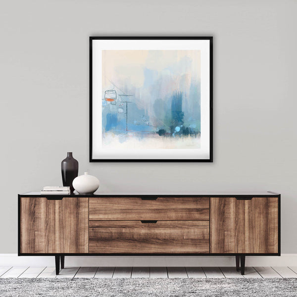 soft blue chairlift framed painting above a console table