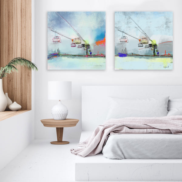 white bedroom with 2 modern mountain art prints on the wall.