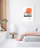 orange retro ski art print framed in a wall in a white bedroom