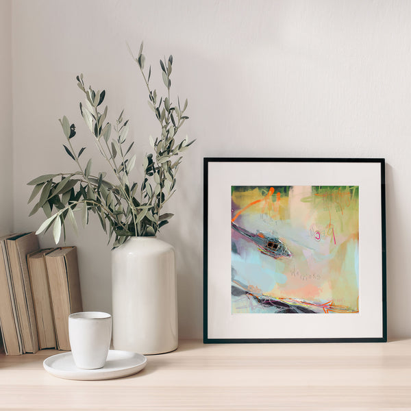 framed ski lodge art print of a helicopter on a worktop with a vase.