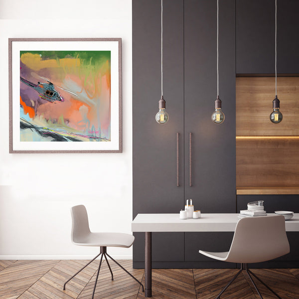 kitchen with a ski mountain print on the wall showing a painterly depiction of a helicopter flying over the mountains in bold colour
