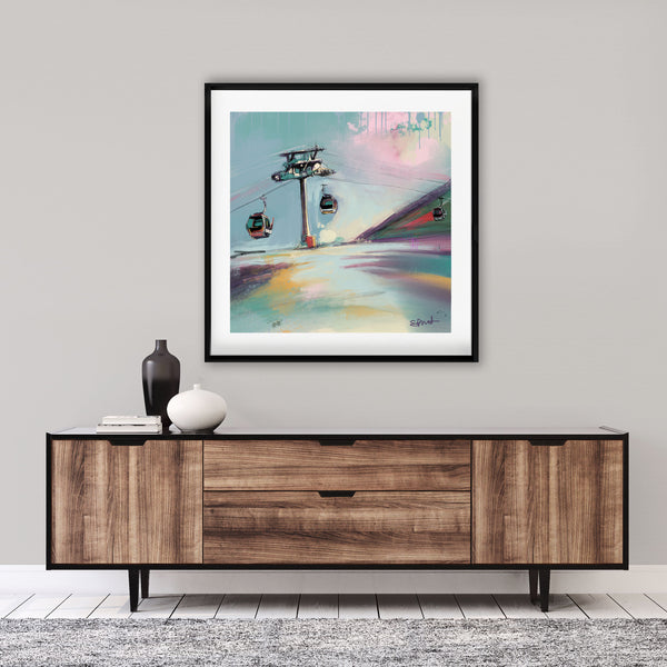 ski resort wall art framed above a console table 